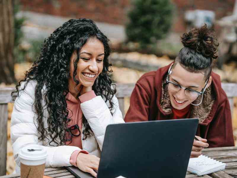 Two girls with computer